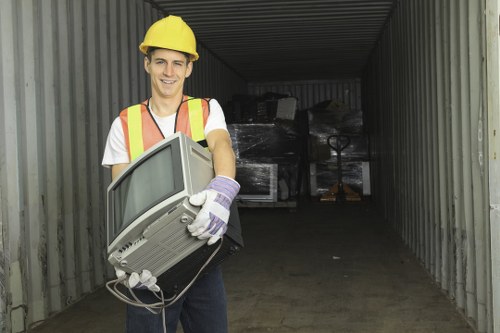 Professional clearing items from a cluttered garage